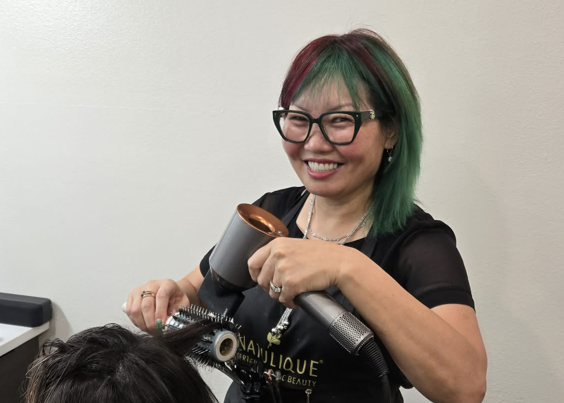 Julia Page working with a client at Julia's Botanical Salon — Private Low-Tox Hair Color Studio in MetroWest Orlando